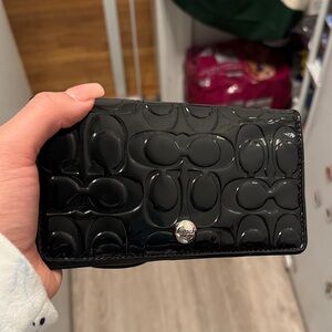 Coach Glossy Black Embossed Clutch
